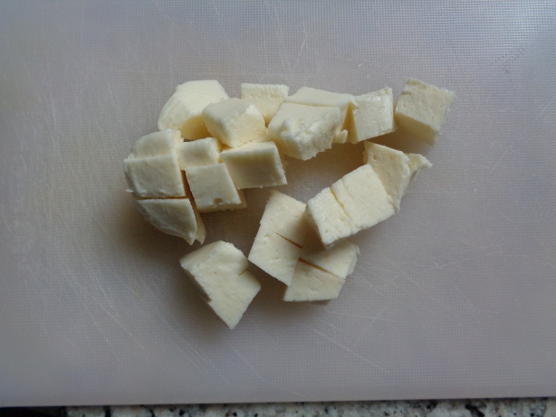 Cut some Mozzarella or feta-cheese into pieces and add it