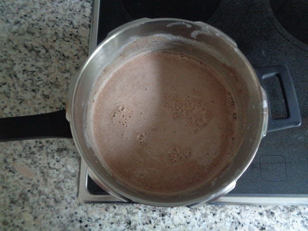 If almost cold, add the chocolate powder and the natural yoghurt
